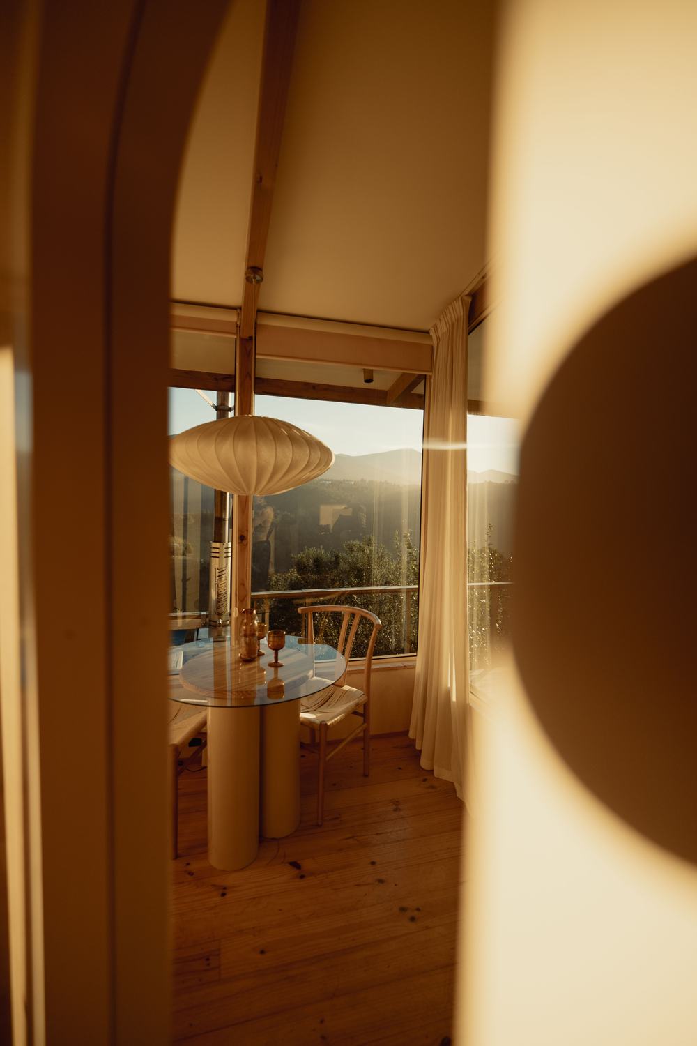 Sunset through the cabin, table set by the window