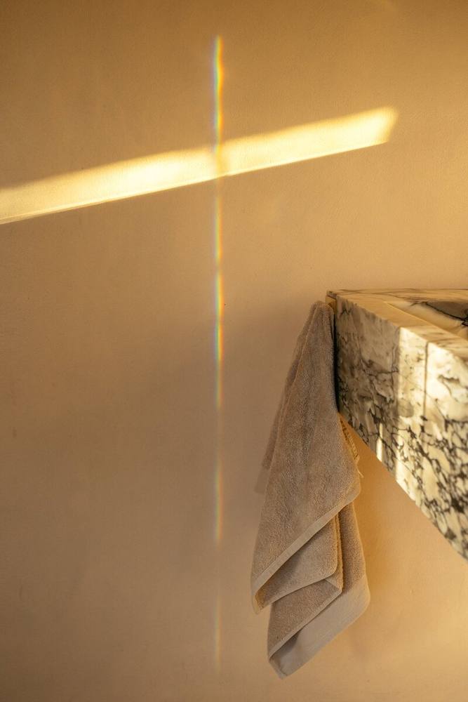 A line of light across the plaster