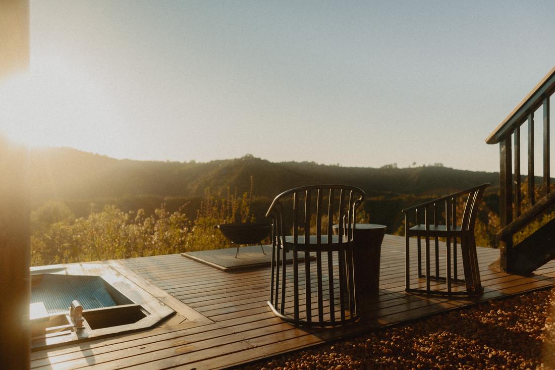 Hot tub and fire pit at sunset