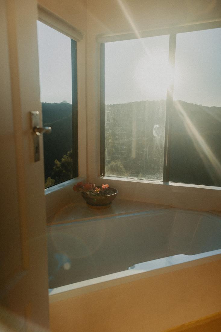 Bath drawn beside the window at sunrise
