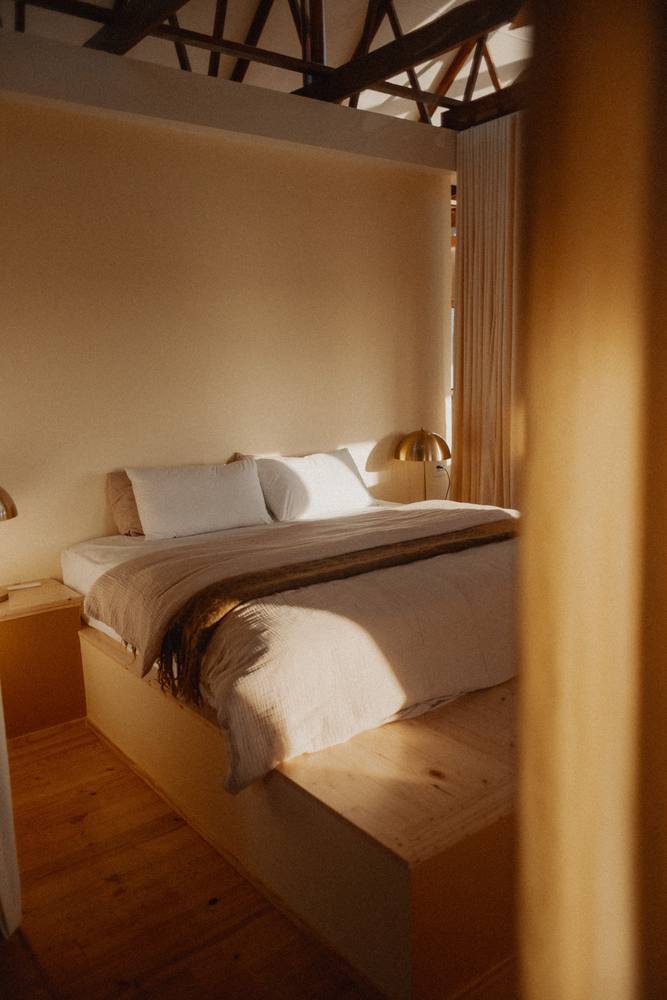 Low sun across the bed