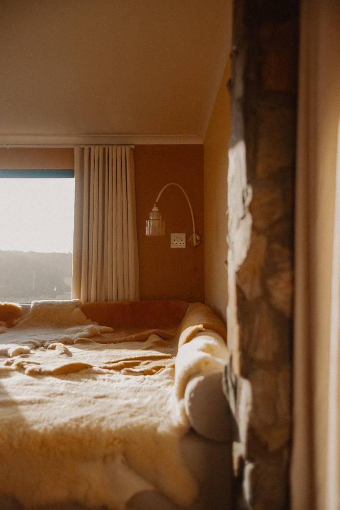 Sunset light on the sheepskin bed