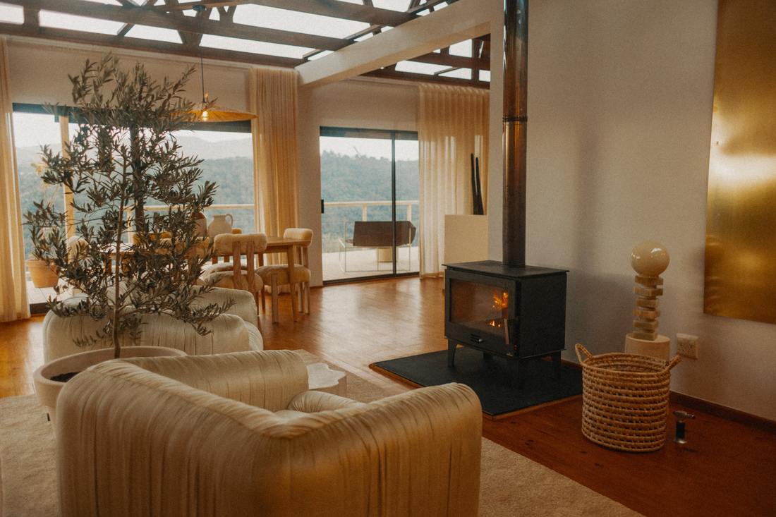 Fireplace lit in the open-plan living room